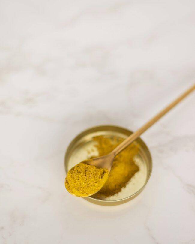 stainless steel spoon on stainless steel spoon on clear glass bowl